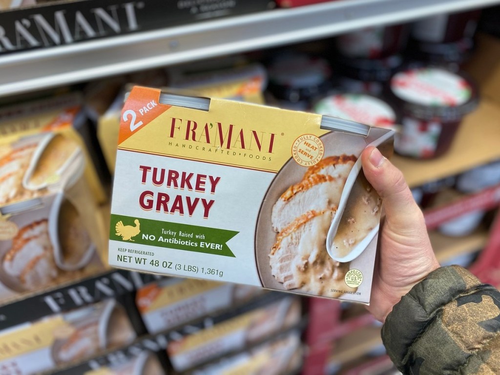holding pre-made turkey gravy at Costco for thanksgiving dinner