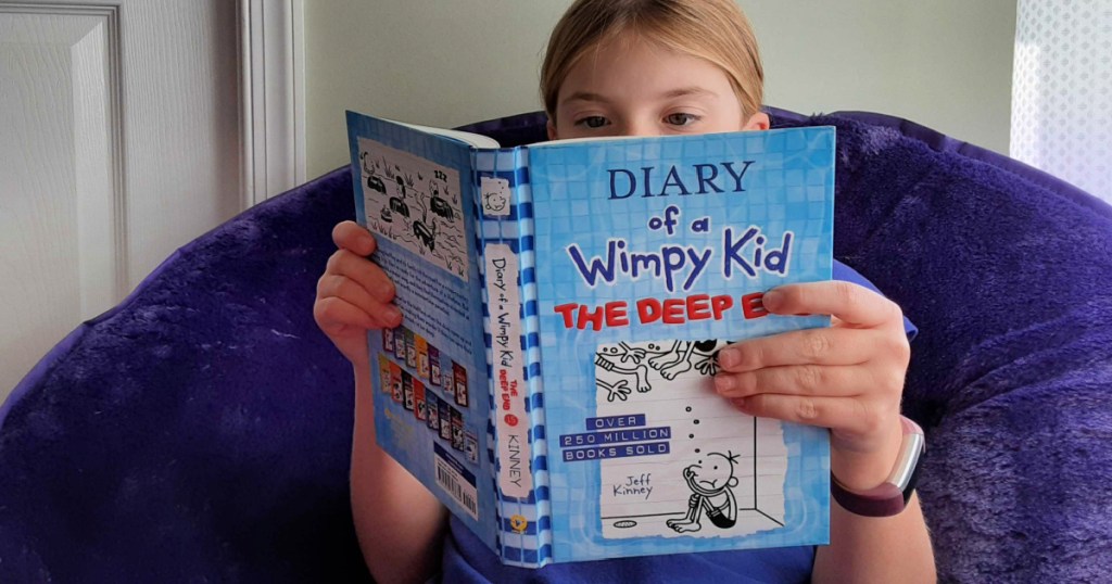 girl reading Diary of a Wimpy Kid The Deep End