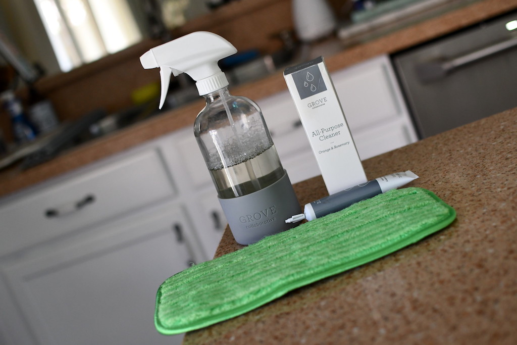 Grove cleaner and spray bottle on counter with Turbo pad 