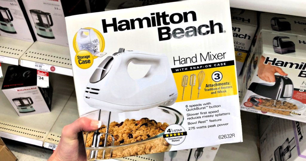 hand holding box with hand mixer in it in store