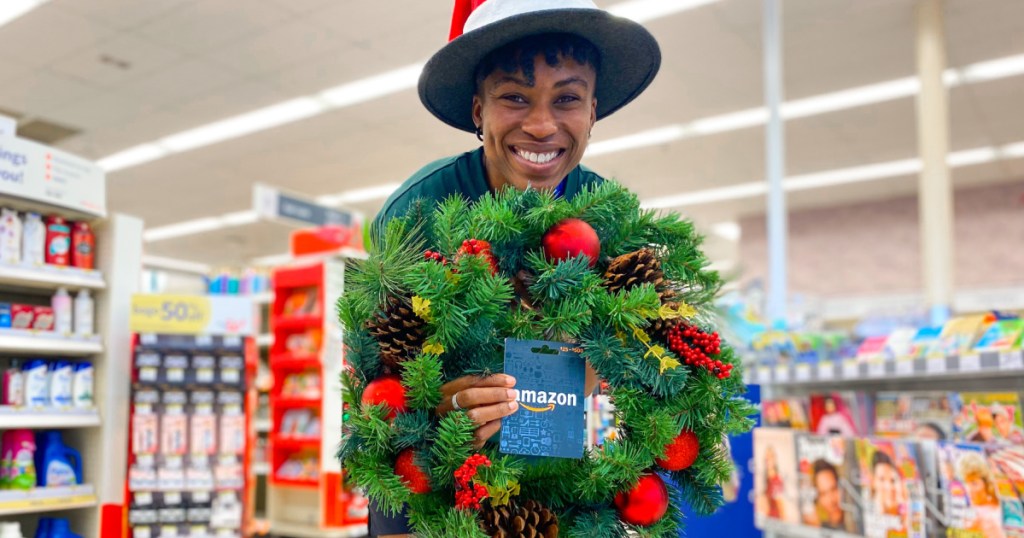 holding wreath and amazon gift card