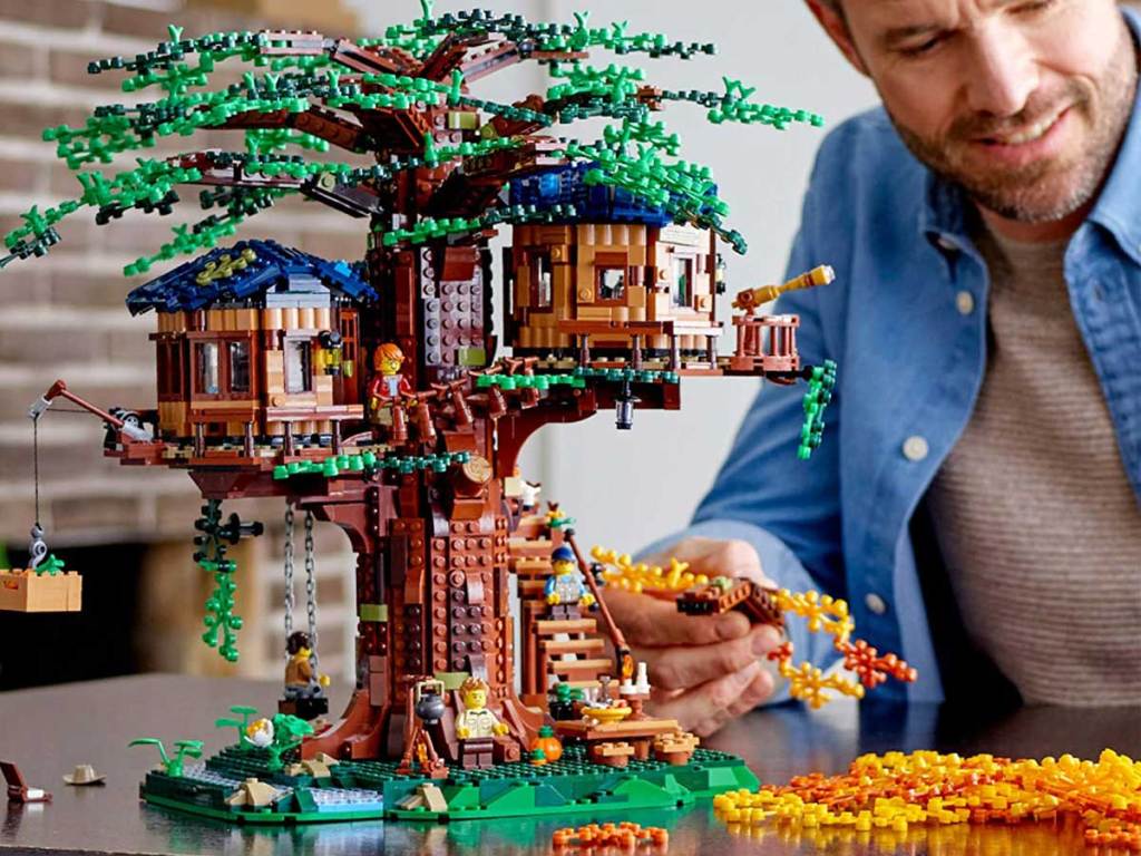 man building a lego tree house
