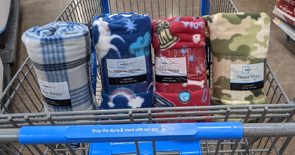 shopping cart with four blankets in it