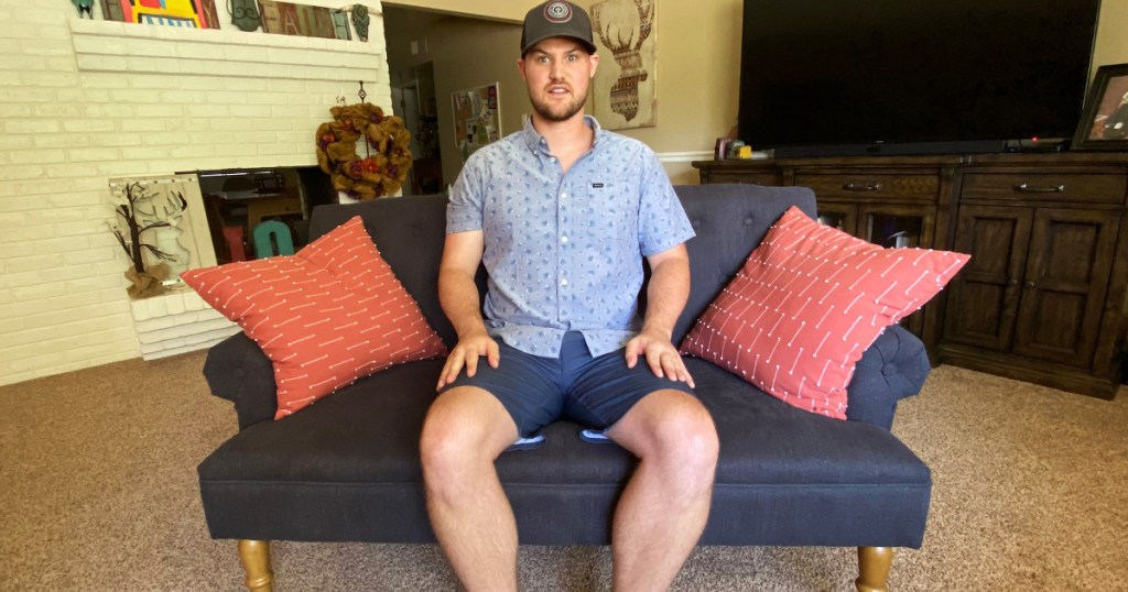 man sitting on tiny couch