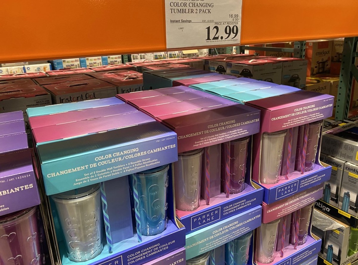 color changing tumblers on display in store with sale sign
