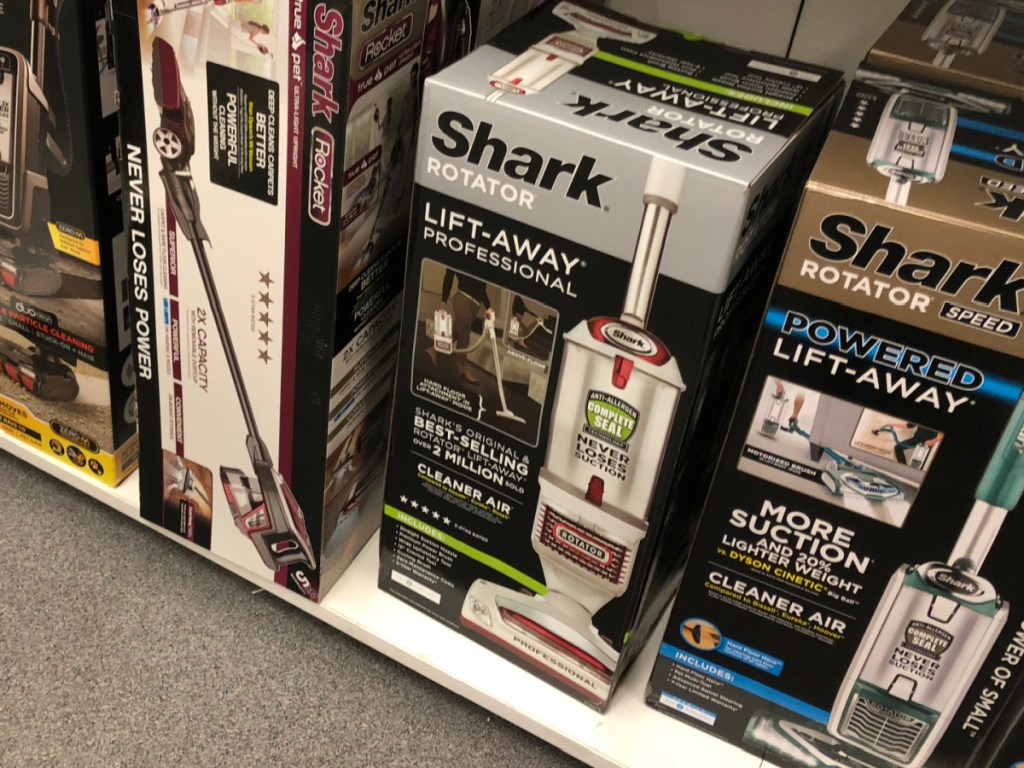 boxes on store shelf with vacuums