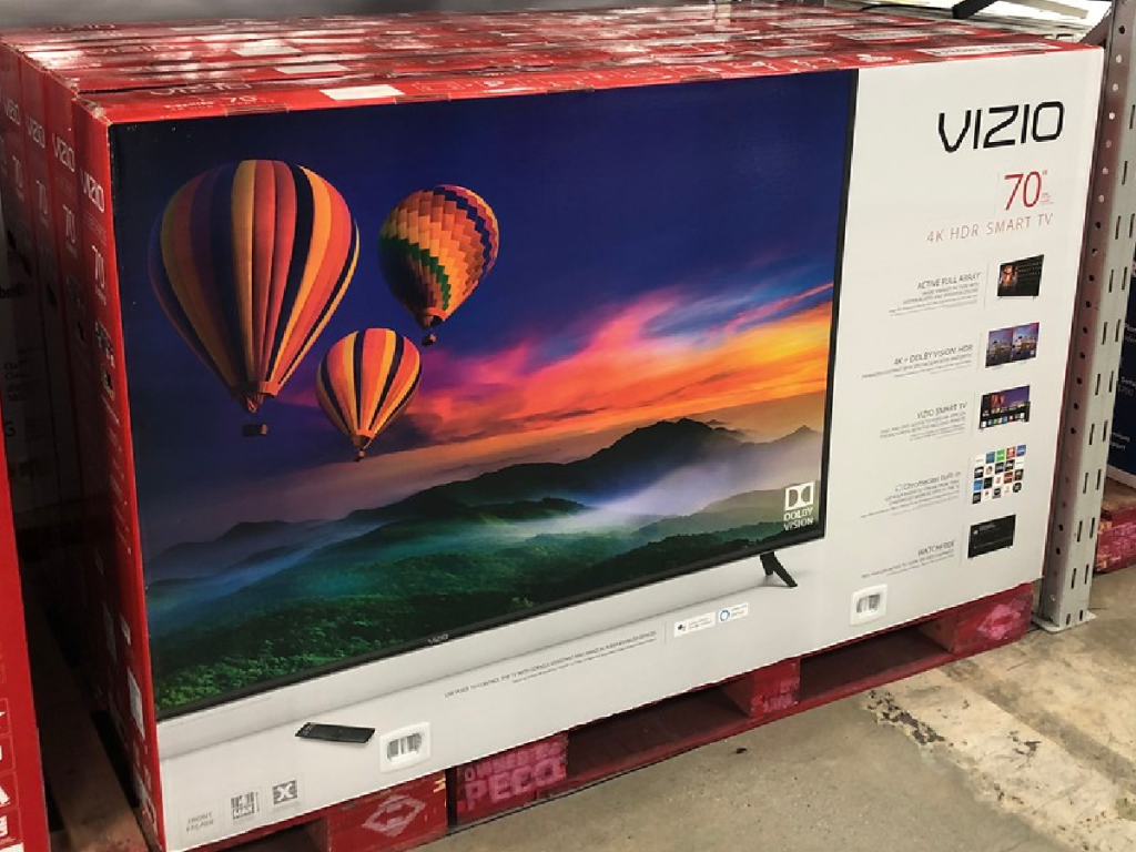 Large box with big TV in it on store display floor