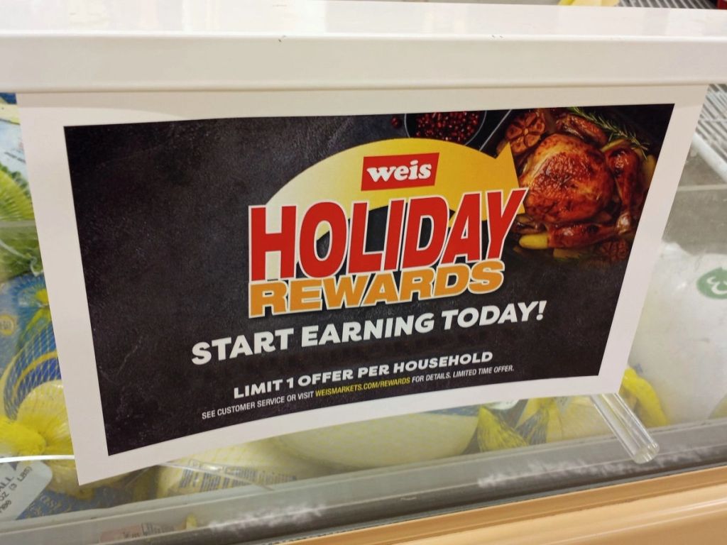 holiday rewards signage at grocery store