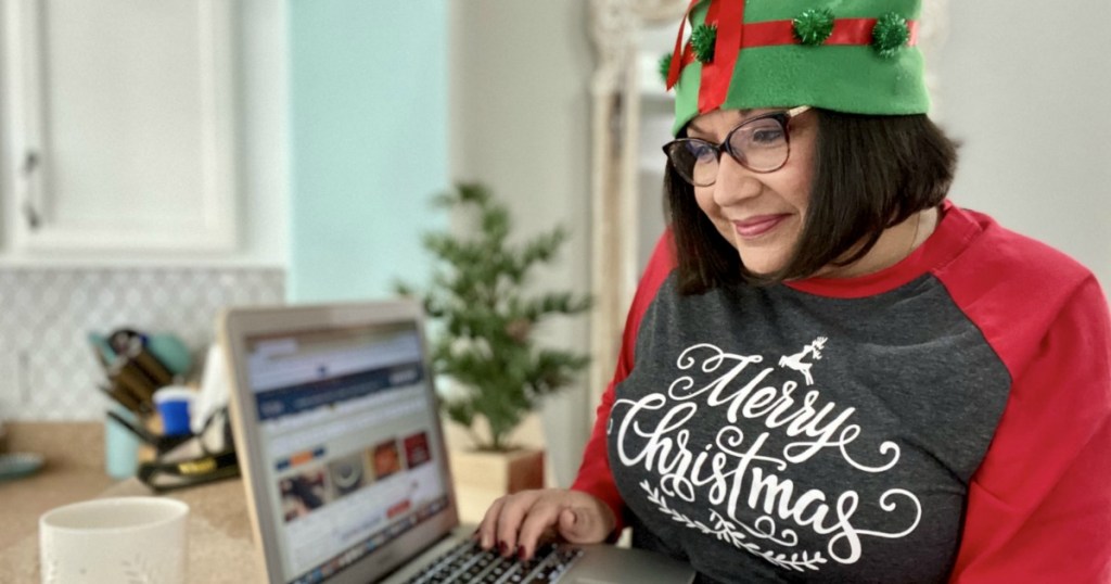 woman on laptop wearing christmas attire
