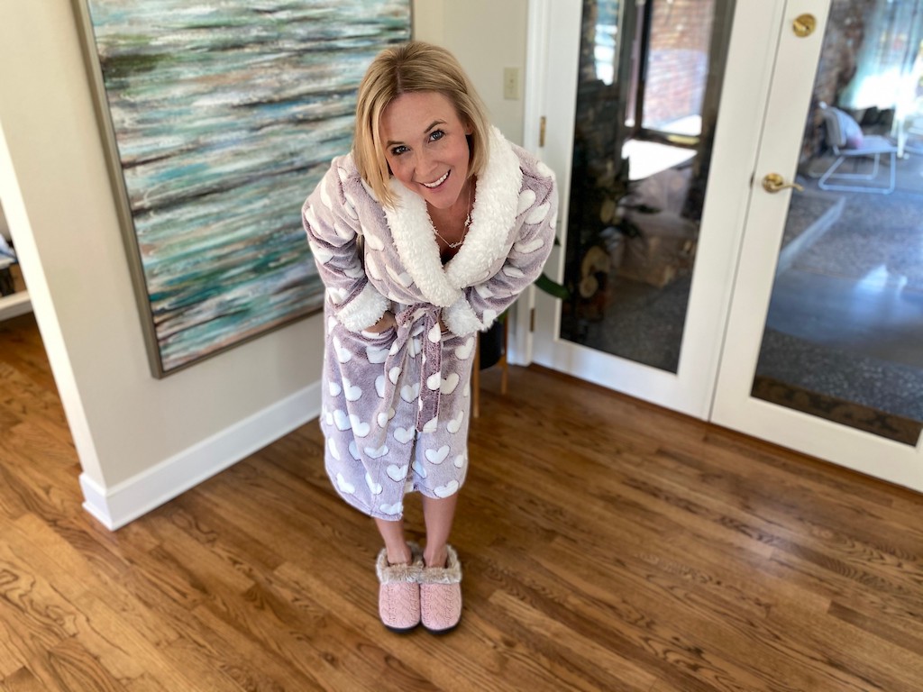 Woman wearing heart robe with Dearfoams slippers 