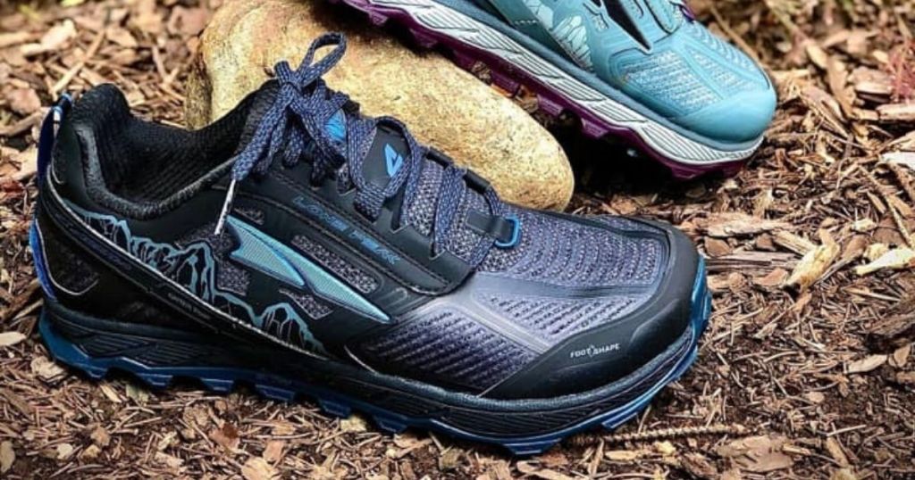 two pairs of altra lone peak trail running shoes in dark blue and light blue
