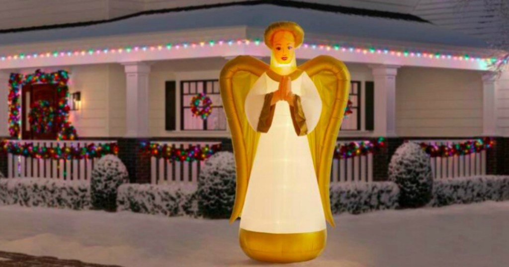 angel decor in a yard with snow
