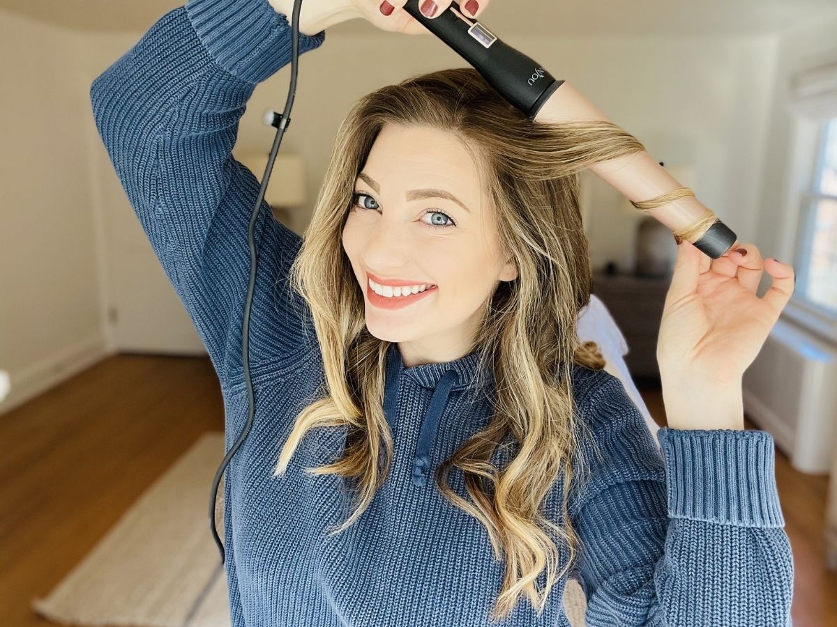 woman curling her hair
