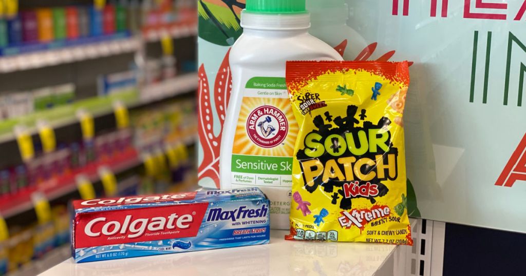 detergent, candy and toothpaste on shelf 