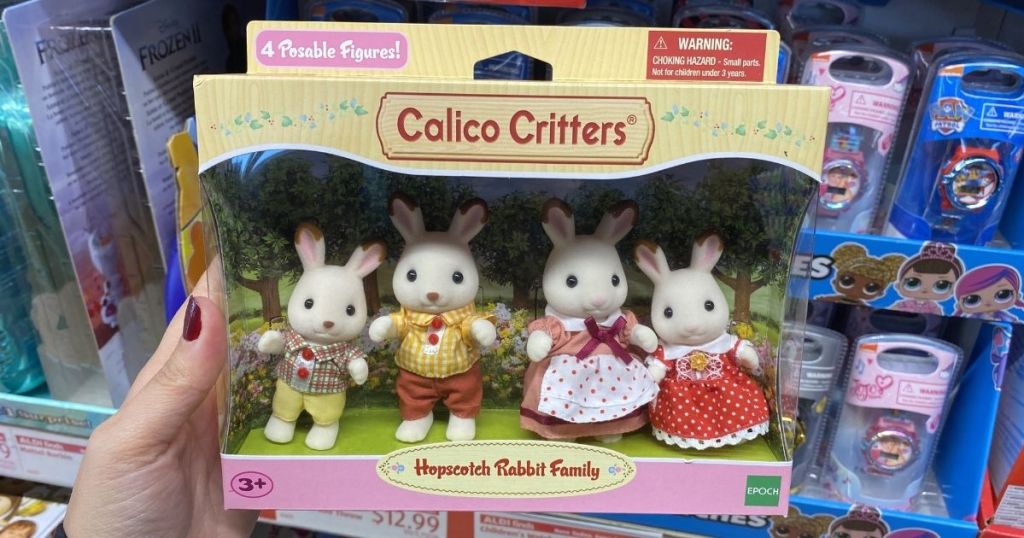 hand holding Calico Critters Rabbit Family
