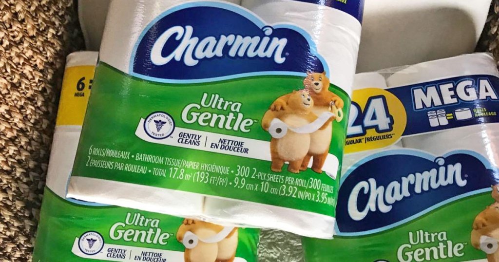 three green and blue packages of charmin ultra gentle toilet paper
