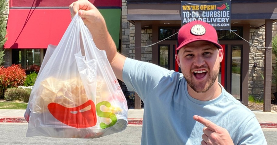 Man holding Chili's to go bag