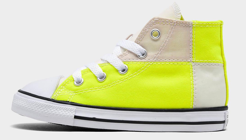 neon yellow and white Converse shoe