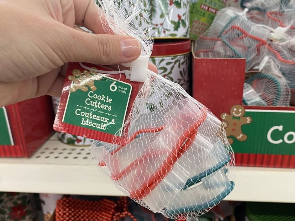 Woman Holding Christmas House Bag of Cookie Cutters