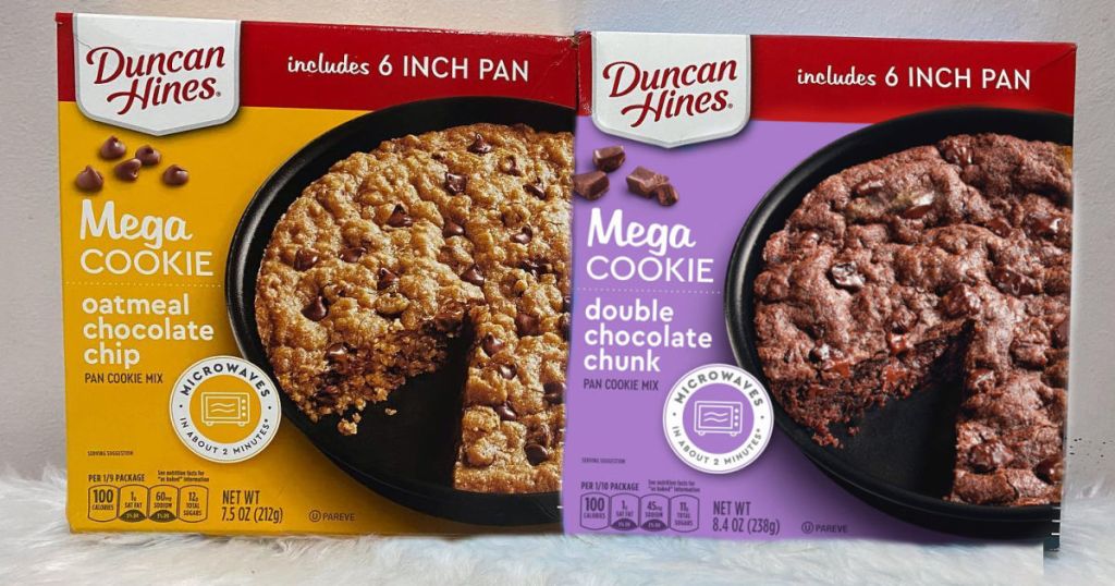 two boxes of duncan hines mega cookies in oatmeal chocolate chip and double chocolate chunk