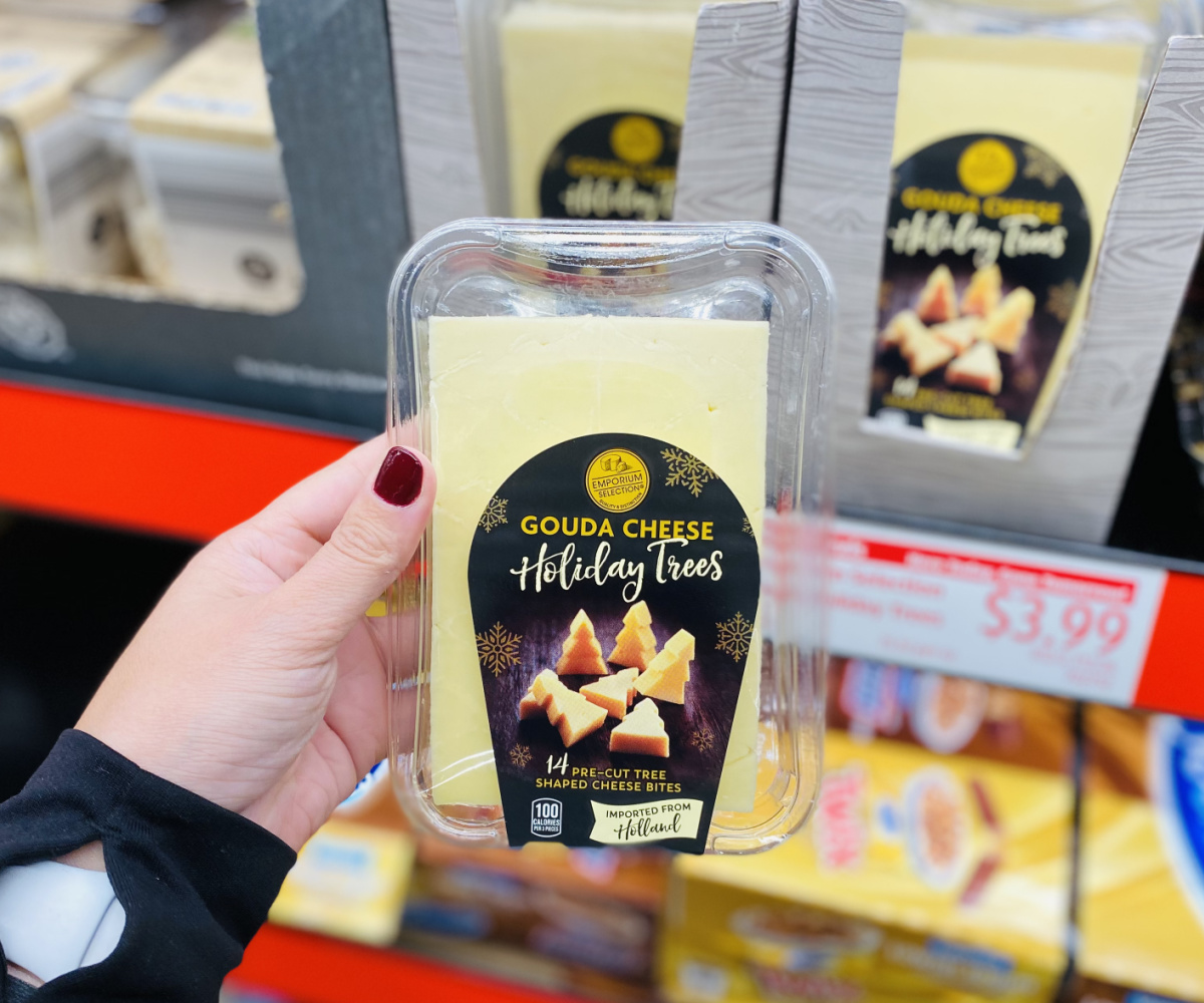 hand holding holiday trees gouda cheese