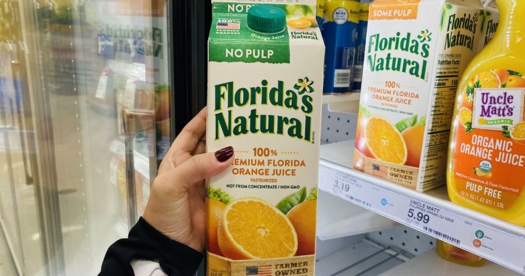 hand holding Florida's Natural Orange Juice