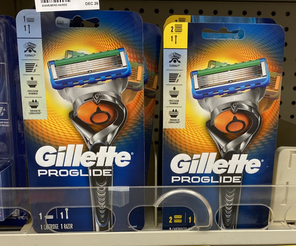 packs of men's razors and refills on store shelf