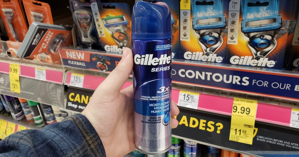 hand holding can of shaving gel in store