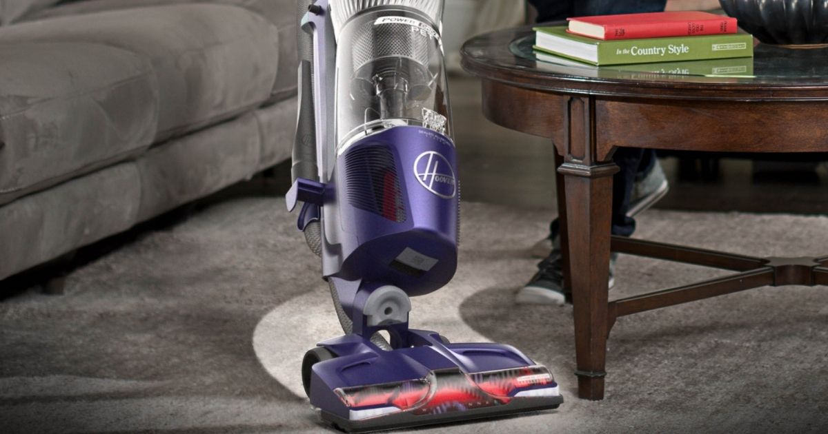 vacuum cleaning carpet in a living room