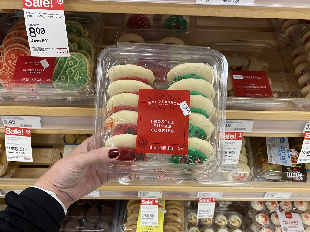 hand holding frosted sugar cookies at target 