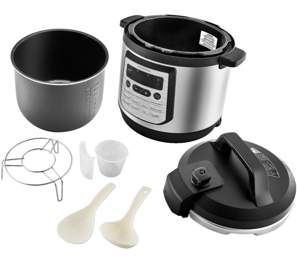 Large multi-cooker with accessories on white surface