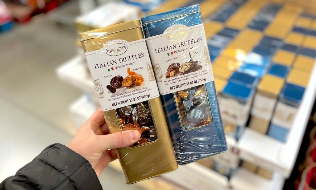 hand holding a gold and blue two pack of italian truffles - sams club gifts