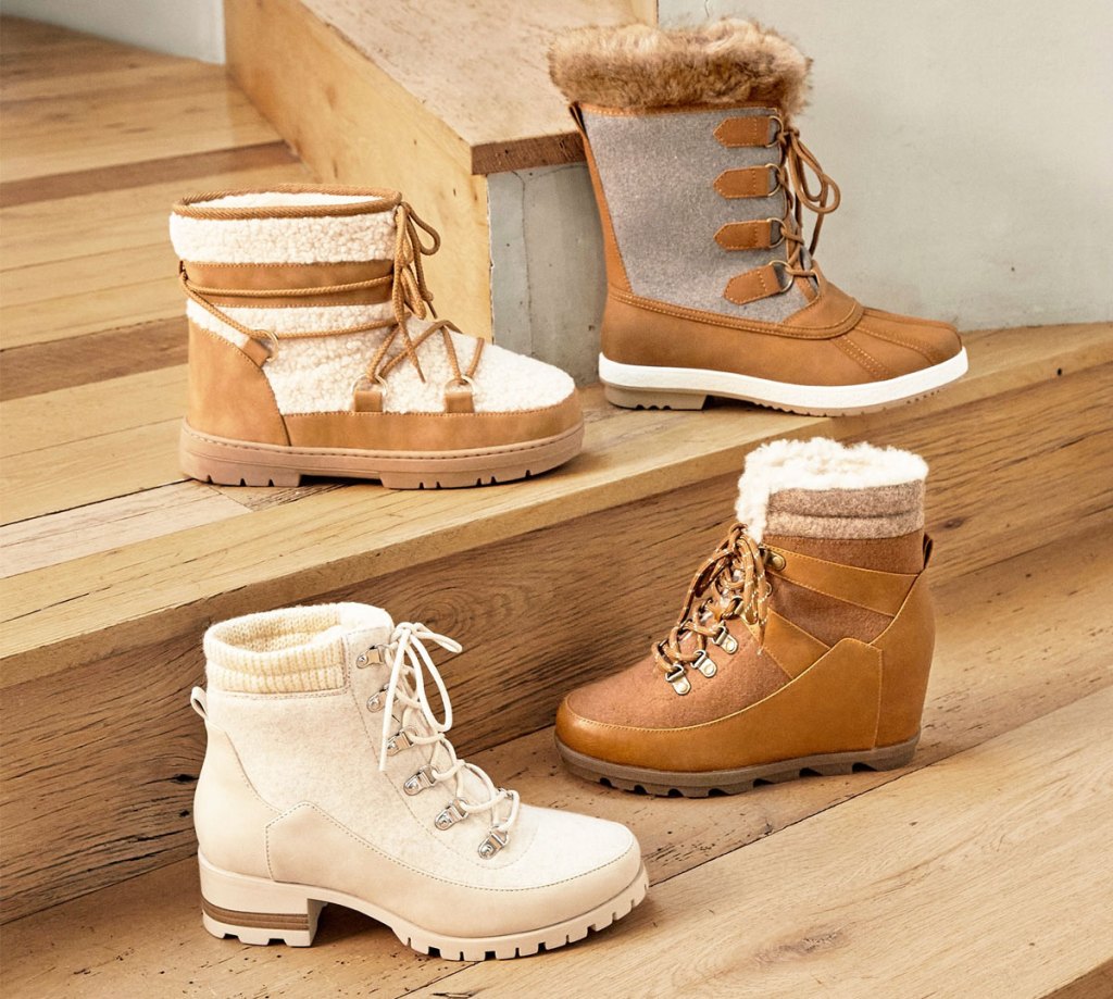 four women's boots on wood stairs