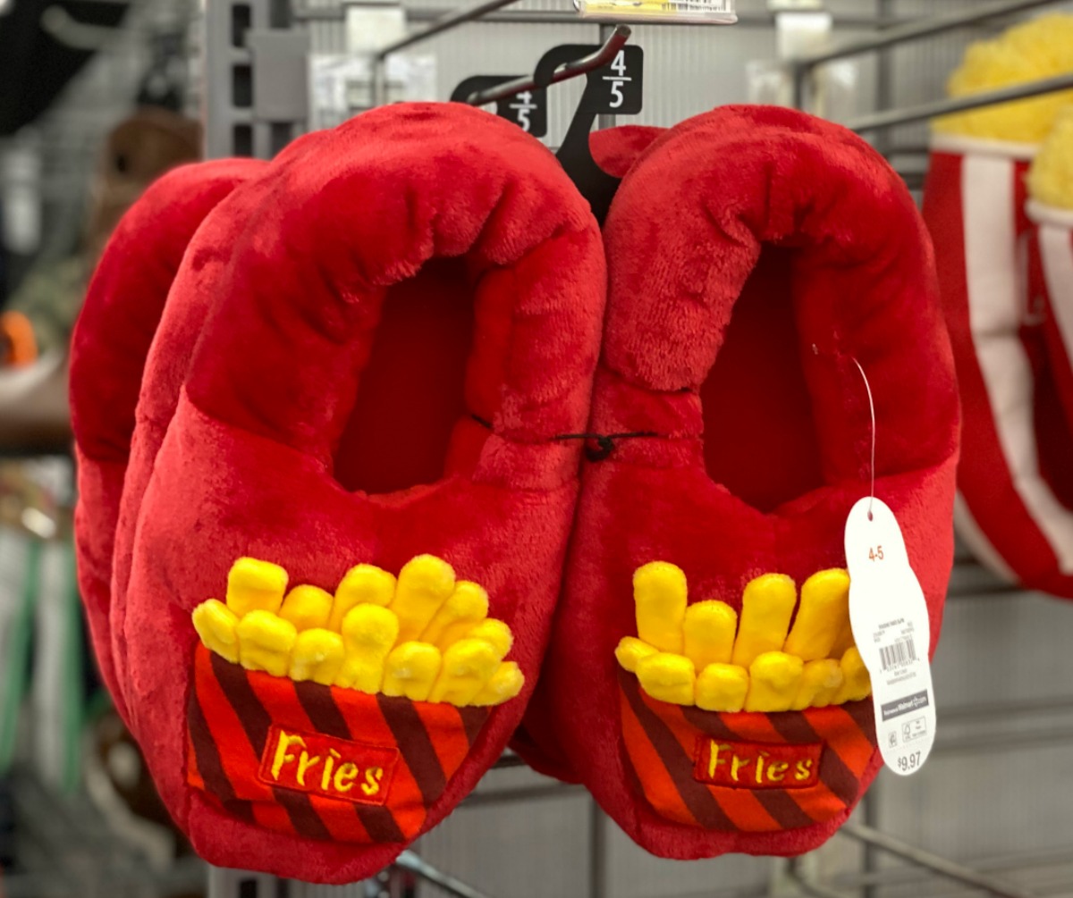 French fry themed slippers for kids hanging from an in-store display