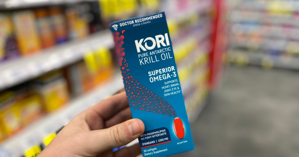 hand holding krill oil pills