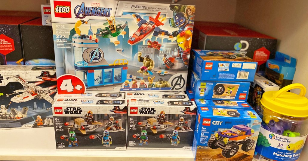 various lego sets on a white shelf at kohl's