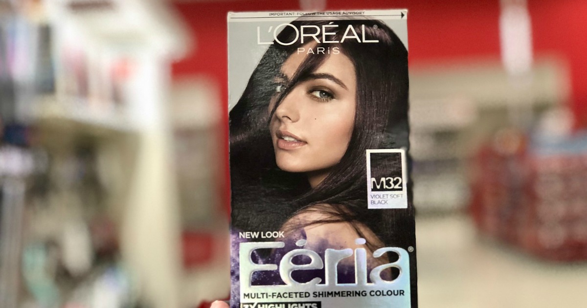 box of L'Oreal Feria Hair Color held up to the camera in a target store