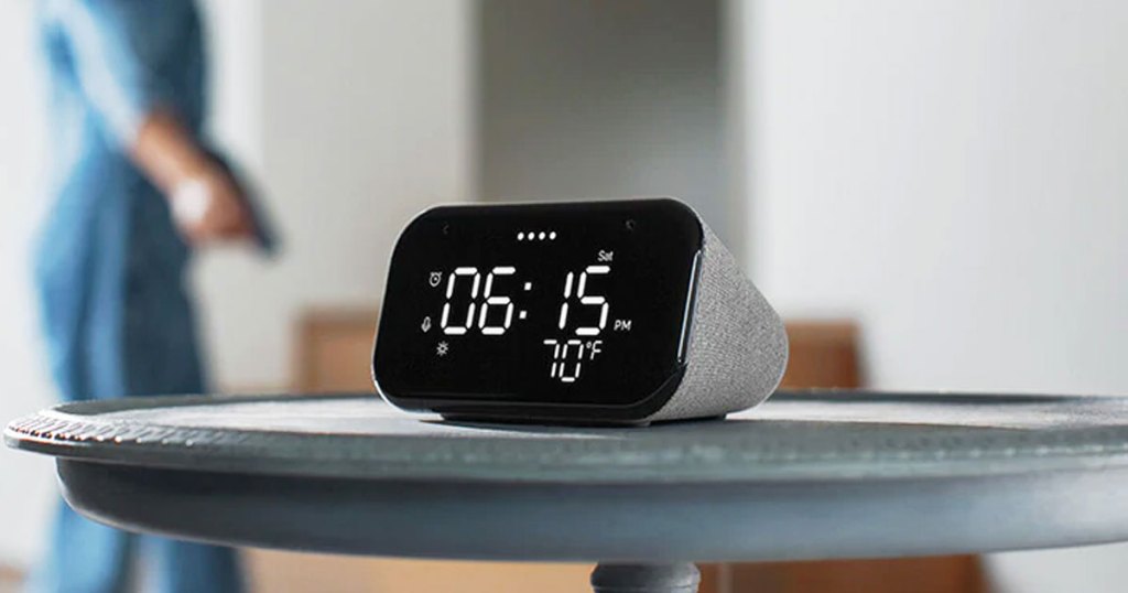 black and grey lenovo smart clock on round side table