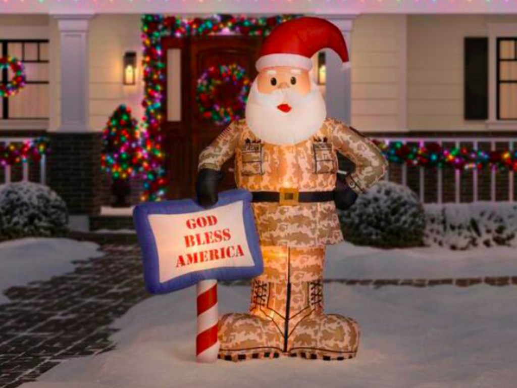 military Santa in a front yard with snow