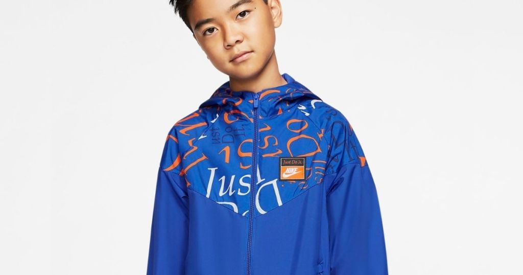 boy wearing a blue Nike jacket
