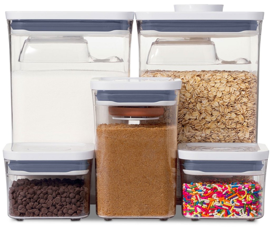 five oxo food storage containers in a variety of different sizes with baking ingredients in each one