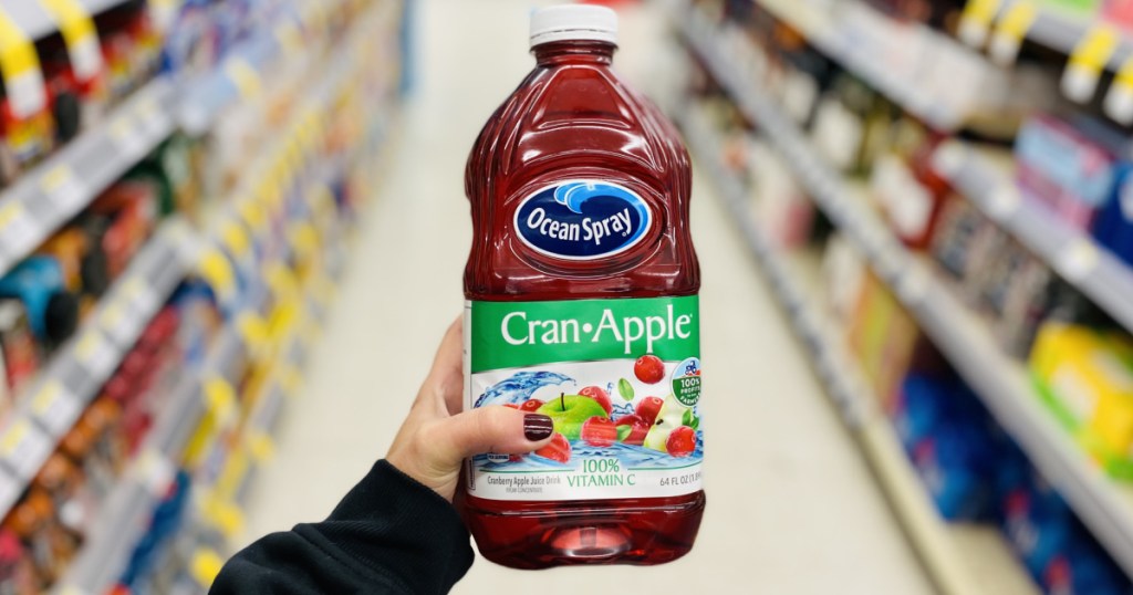 hand holding cranberry juice 