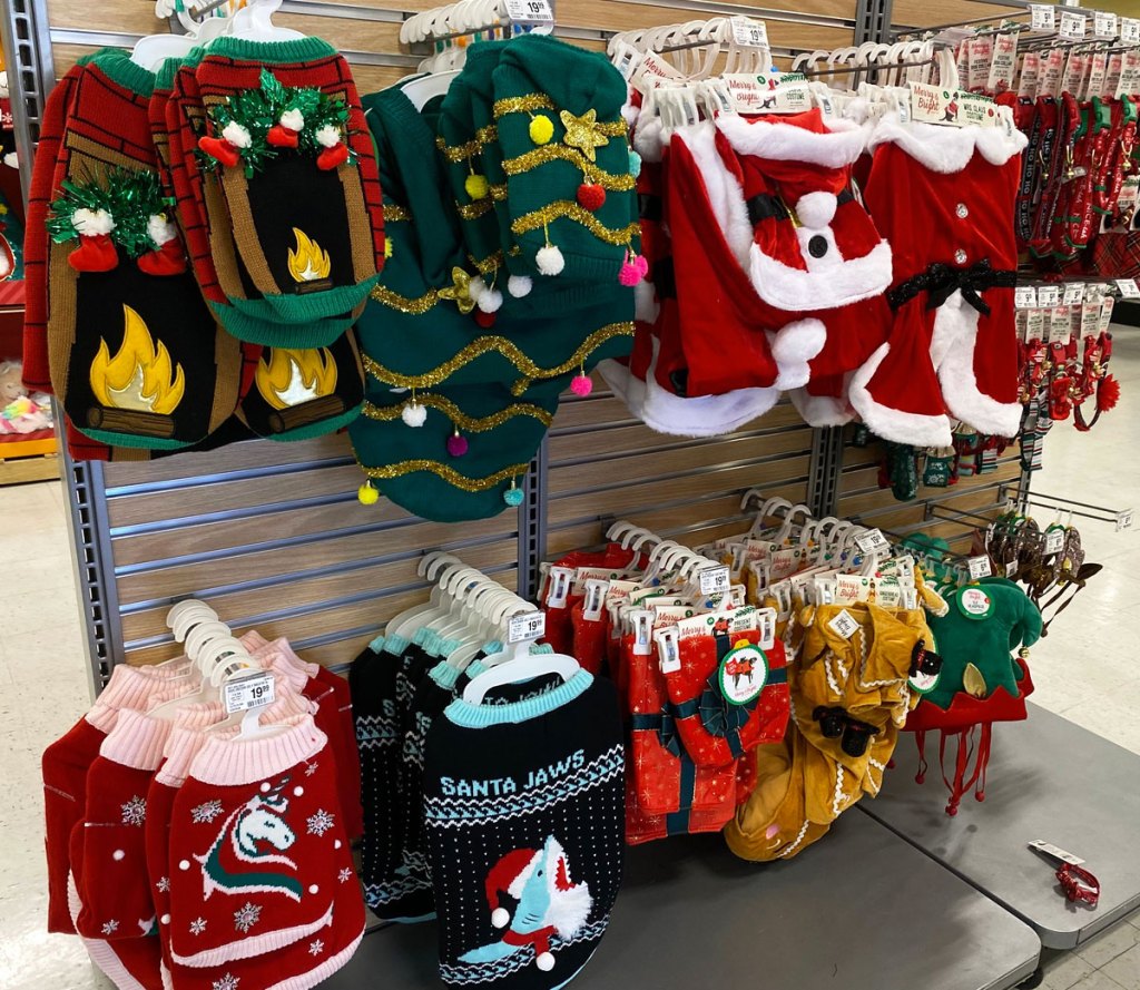 various ugly christmas sweaters for dogs on display at petsmart