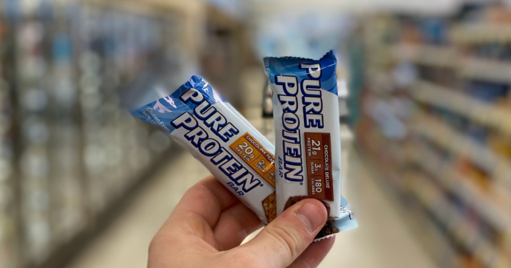 hand holding protein bars 
