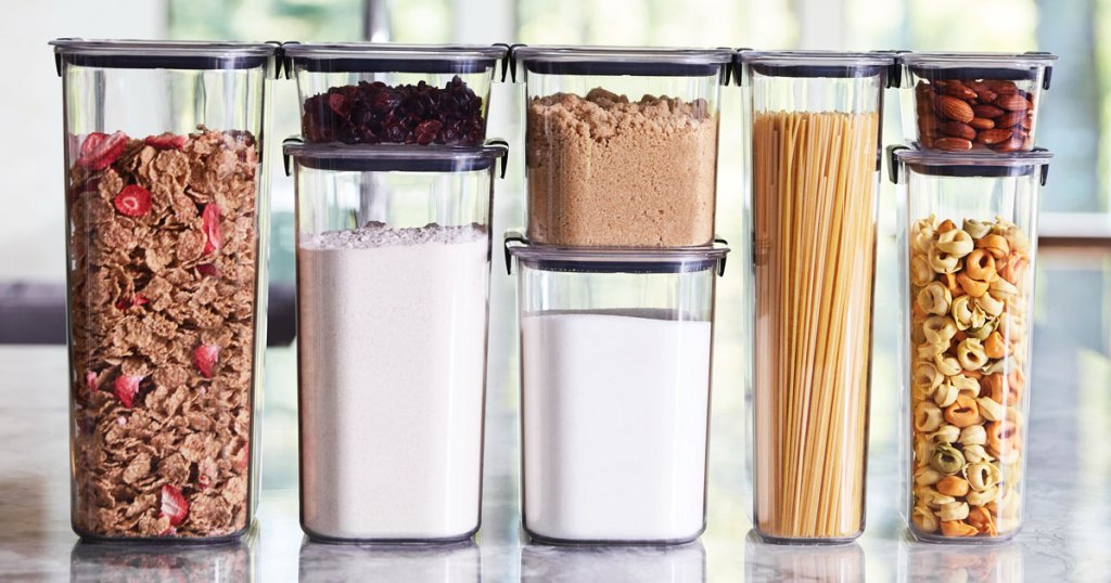clear food storage containers on kitchen counter with various foods and baking ingredients inside
