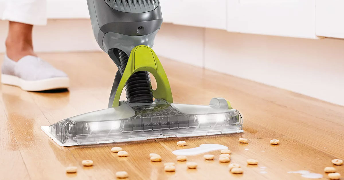 grey shark vacmop cleaning up spilled cereal and milk on hardwood floor