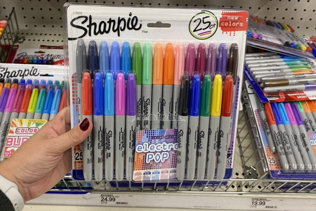 hand holding large pack of permanent markers in store