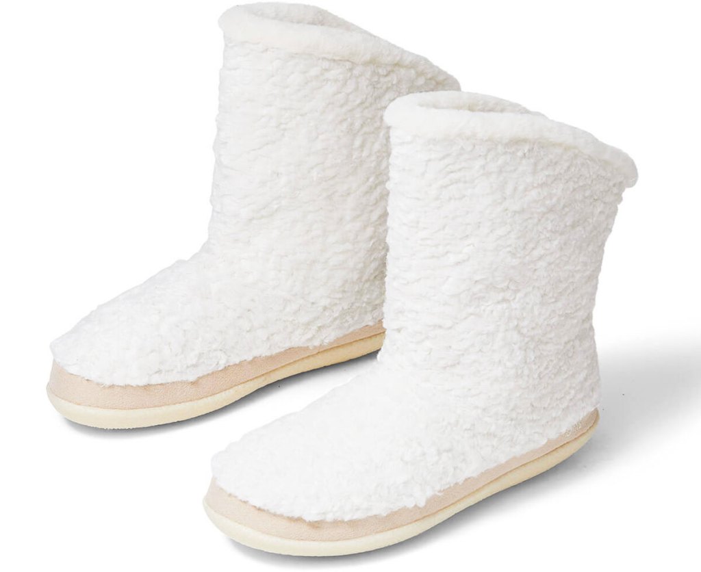 pair of white plush fuzzy slipper boots