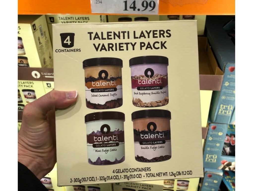 Woman holding Talenti Layers Variety Pack in Costco