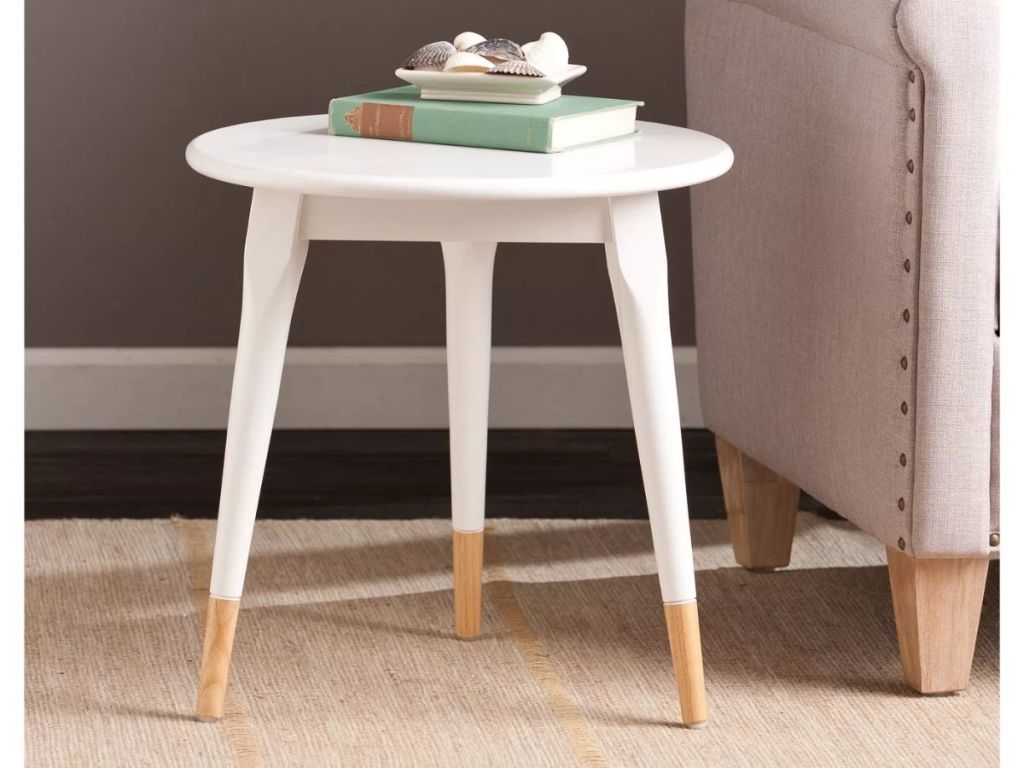 Target White Side Table next to tan couch